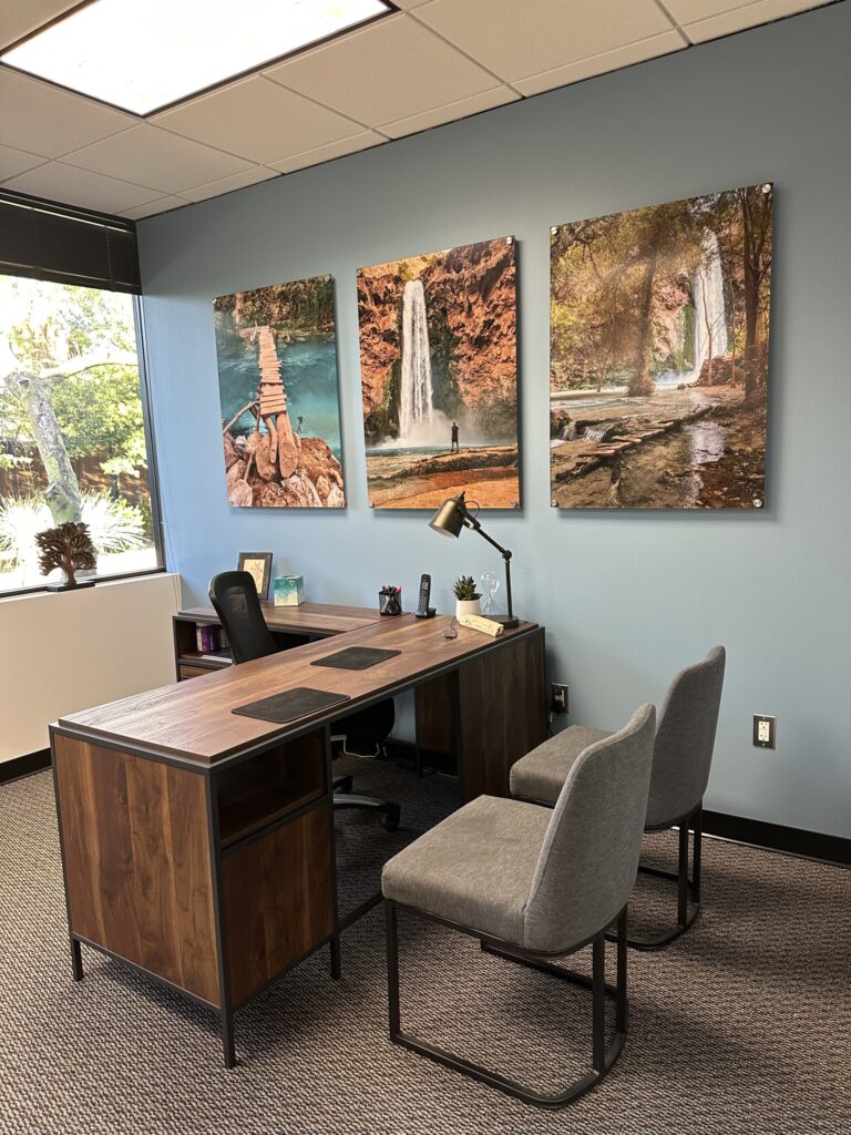 Our client showcasing his own photography in his office.